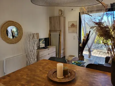 a living room with a table with a candle on it at Le Phoenix de Sainte Victoire in Saint-Marc-Jaumegarde