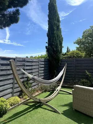 a hammock sitting on the grass in a garden at Ocra Pure in Roussillon