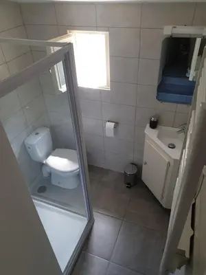 a small bathroom with a toilet and a sink at Atelier n°4 in Fontaine-de-Vaucluse