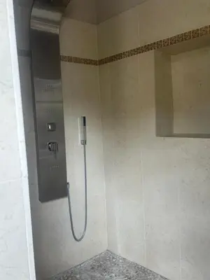 a shower stall in a bathroom with a shower at Le mas jasmins in Ménerbes