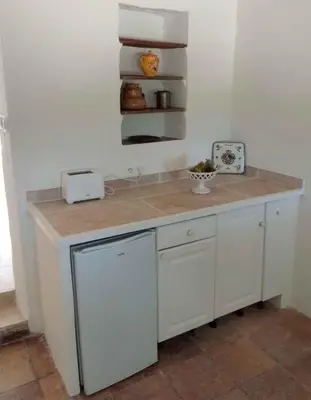 a kitchen with a counter with a counter top at Santonne in Apt