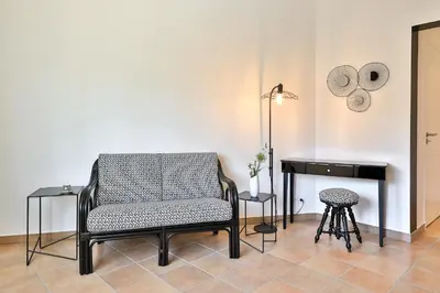 a chair and a desk in a room at Quintessence Provence in Goult