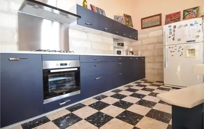 a dog and a baby bird standing in a park at 2 Bedroom Beautiful Home In Avignon in Avignon