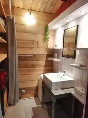 a bathroom with a white sink and a mirror at Moulin de Bonfilhon in Cornillon-Confoux