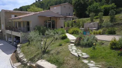 a house with a garden in front of it at Mas des Genêts in Manosque