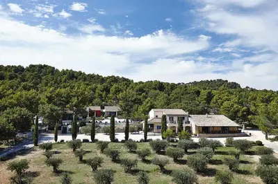 an aerial view of a house with a yard at Hôtel le Jas de Joucas in Joucas
