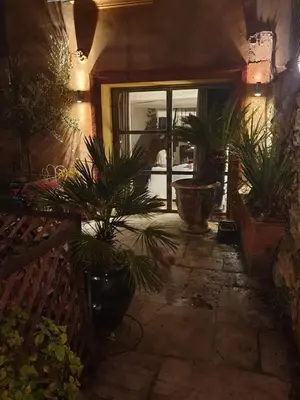 a room with potted plants and a window at la villageoise, chambre troglodyte pitoresque au cœur du village in Rognes