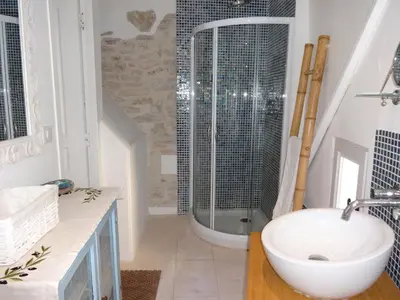 a bathroom with a sink and a shower at La Marisol in LʼIsle-sur-la-Sorgue