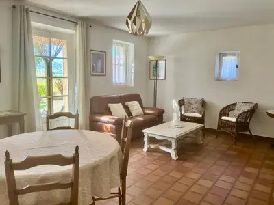 a living room with a couch and a table at Chez Suzanne in Bonnieux