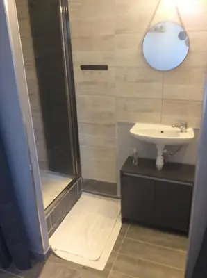 a bathroom with a shower and a sink at Ogooué Studio in Carpentras