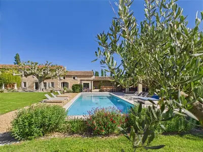 a house with a swimming pool in a yard at Magnifique Mas Provençal avec Piscine à Eygalières - 19 Couchages, 8 Chambres, Billard, et Plus ! - FR-1-599-3 in Eygalières