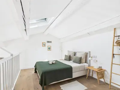 a white bedroom with a bed with a green blanket at Magnifique Mas Provençal avec Piscine à Eygalières - 19 Couchages, 8 Chambres, Billard, et Plus ! - FR-1-599-3 in Eygalières