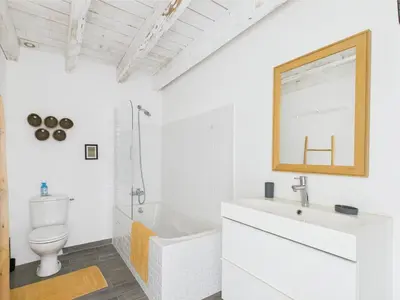 a white bathroom with a sink and a toilet at Magnifique Mas Provençal avec Piscine à Eygalières - 19 Couchages, 8 Chambres, Billard, et Plus ! - FR-1-599-3 in Eygalières
