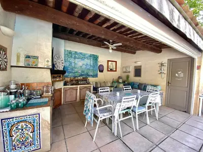 a kitchen and dining room with a table and chairs at « CARPE DIEM » in Aix-en-Provence