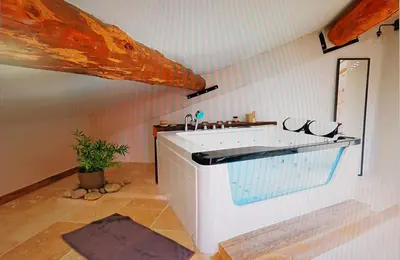 a bathroom with a sink in a room at Appartement de charme Sud Luberon classé 4 étoiles in Puyvert