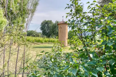 a stone tower in the middle of a field at Mas de Bacalan in Mormoiron
