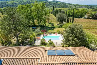 an aerial view of a house with a swimming pool at Mas de Bacalan in Mormoiron