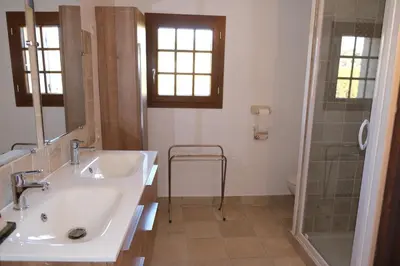 a bathroom with a sink and a shower at typical mas provençal with swimming pool in a small hamlet near mouriès in the alpilles in provence- 8 persons in Mouriès