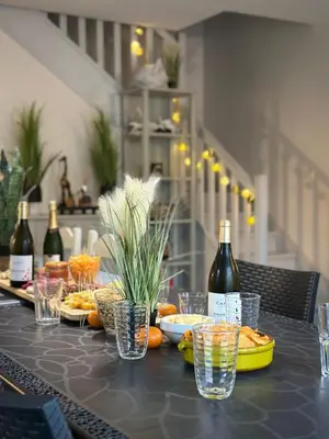 a table with food and bottles of wine on it at Les Demeures du Ventoux in Aubignan