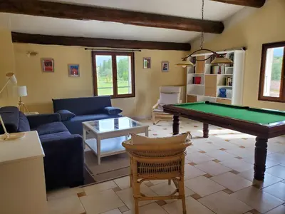 a living room with a pool table in it at Gîte Les Murmures du Ventoux in Mormoiron