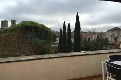 a view of a garden from a balcony with trees at Duplex lumineux sur gde TERRASSE, BALNEO double, parking privé, CLIM, local vélos in Entraigues-sur-la-Sorgue