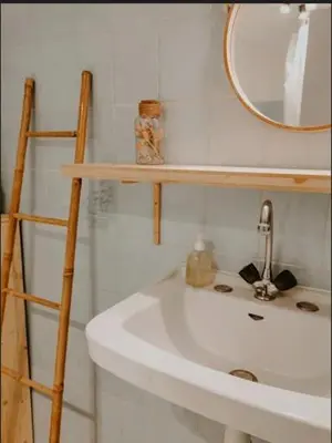 a bathroom with a white sink and a mirror at La Source in Oppedette