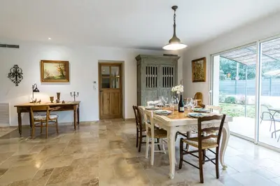 a kitchen and dining room with a table and chairs at Stunning house on the edge of the Luberon in Cheval-Blanc