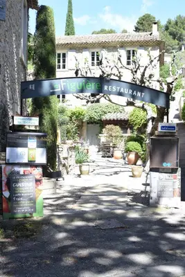 a sign for a reference restaurant in front of a building at La Figuiere Fontaine de Vaucluse in Fontaine-de-Vaucluse