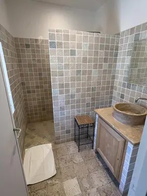 a bathroom with a sink and a shower at La Figuiere Fontaine de Vaucluse in Fontaine-de-Vaucluse