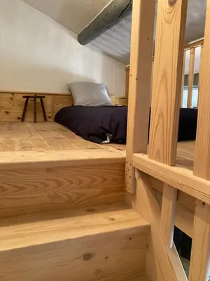 a bedroom with two bunk beds in a log cabin at Grande terrasse CLIM parking privé SMART TV, local velos in Entraigues-sur-la-Sorgue