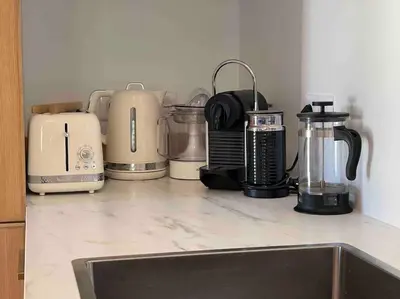 a group of appliances sitting on a kitchen counter at Mas de la Pivoine in Le Puy-Sainte-Réparade