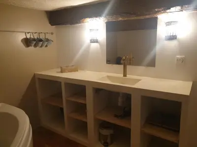 a bathroom with a sink and a mirror at Charmant appartement cœur village provençal in Lambesc