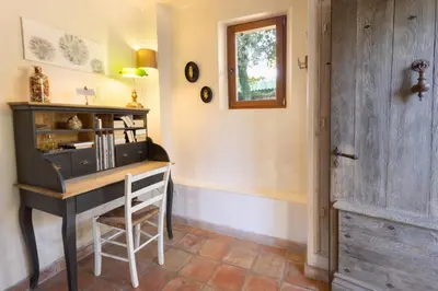 a home office with a desk and a door at La Bastide des Milles in Apt