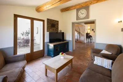 a living room with two couches and a table at La Bastide des Milles in Apt