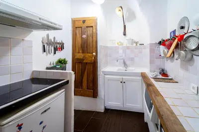 a kitchen with a counter top with a microwave at Le petit carnot in Apt
