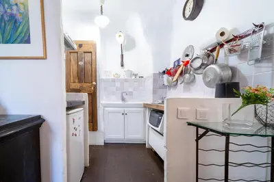 a bathroom with a sink and a toilet and a shower at Le petit carnot in Apt