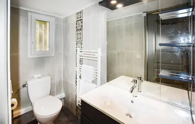 a bathroom with a toilet and a sink and a shower at Nice Apartment In Caumont-Sur-Durance in Caumont-sur-Durance
