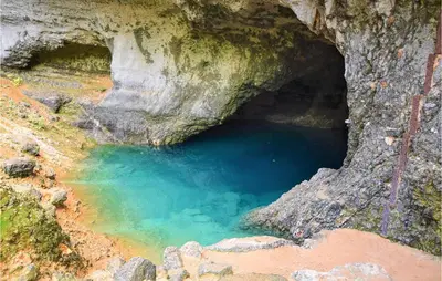 a cave with a blue pool of water at Nice Apartment In Caumont-Sur-Durance in Caumont-sur-Durance