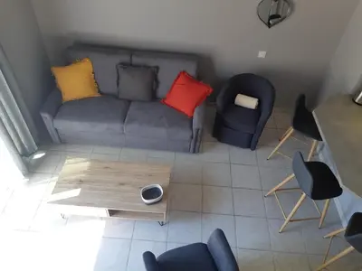 an overhead view of a living room with a couch and chairs at MAS PAPABIOU in Eygalières