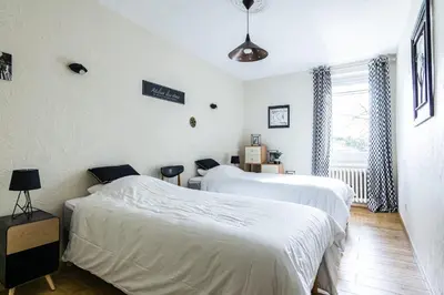 a bedroom with two beds and a window at Stunning property between Alpilles and Luberon in Cavaillon