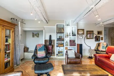 a living room with a red couch and chairs at Stunning property between Alpilles and Luberon in Cavaillon