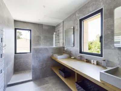a bathroom with a sink and a mirror at Villa rénovée à Eygalières avec piscine chauffée - FR-1-599-19 in Eygalières