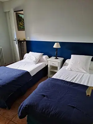 two beds sitting next to each other in a room at bastide St Joseph in Eyguières