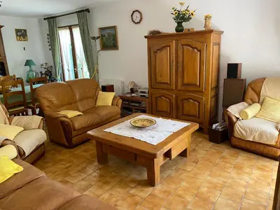 a living room with couches and a coffee table at Maison provençale en campagne à Eguilles in Éguilles