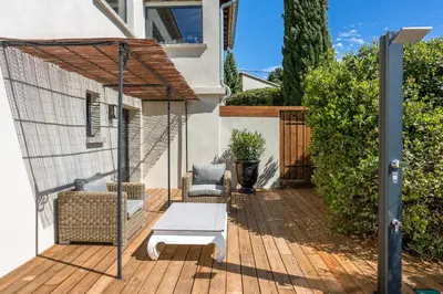 a patio with a hammock and a swing at Villa Domitia Chambre d'Hôtes Luberon in Bonnieux