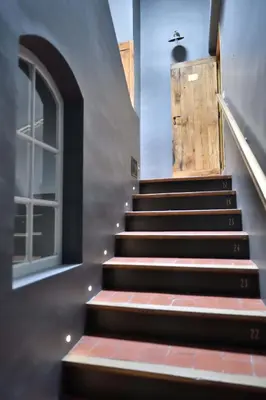a set of stairs leading up to a door at La Maison de Lourmarin in Lourmarin