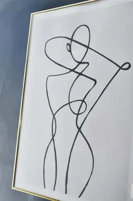 a drawing in a gold frame on a table at La Maison de Lourmarin in Lourmarin