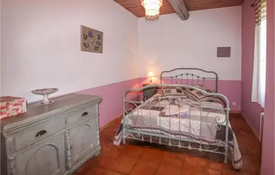 a bedroom with a bed and a dresser in it at Pet Friendly Home In Apt in Apt