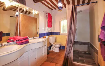 a bathroom with a sink and a toilet and a shower at Pet Friendly Home In Apt in Apt