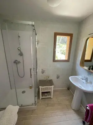 a bathroom with a shower and a sink at Les Cigales in Villelaure